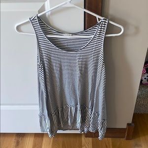 Long black/white striped tank with angle cut.